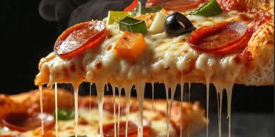 A hot slice of pizza with melting cheese and toppings.