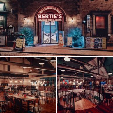 Cozy restaurant interior and entrance with warm lighting and rustic decor.