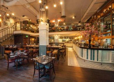 Elegant restaurant interior with warm lighting and vintage decor.