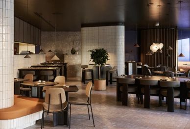 Modern stylish restaurant interior with cozy seating and warm lighting.