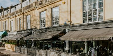 Outdoor cafes along a historic street.