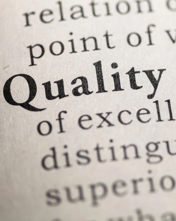Close-up of the word 'Quality' in a dictionary text.
