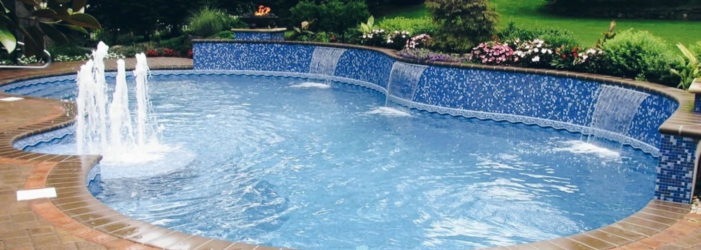 In-ground pool with beautiful fountain, Patio Paver Construction and Landscape design