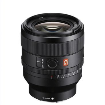 Sony G Master camera lens with aperture ring and AF/MF switch.