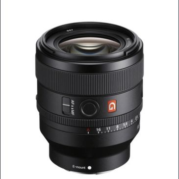 Sony G Master camera lens with aperture ring and AF/MF switch.
