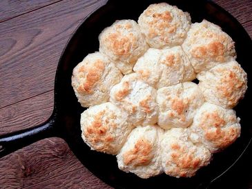 A pan of Mrs. Bug’s Buttermilk Drop Biscuits from Outlander Kitchen.
