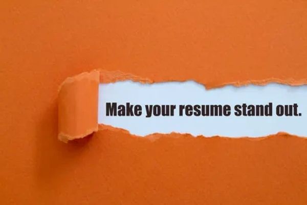 Torn orange paper reveals the text: 'Make your resume stand out.'
