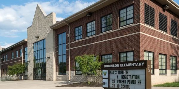 Exterior of Robinson Elementary School with sign.