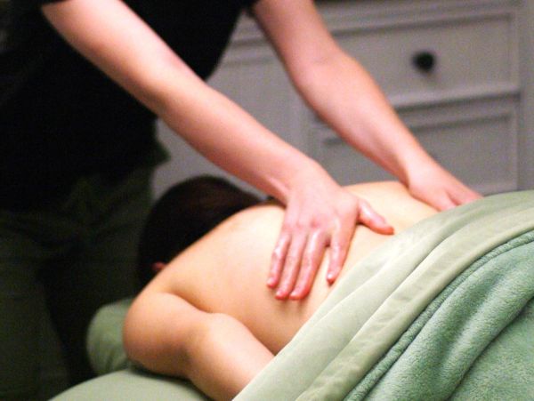 Person receiving a back massage.