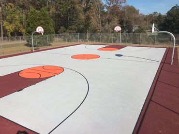Multi-court basketball resurfacing with custom color coating