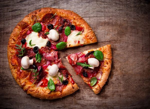 Delicious Italian pizza served on a wooden table.