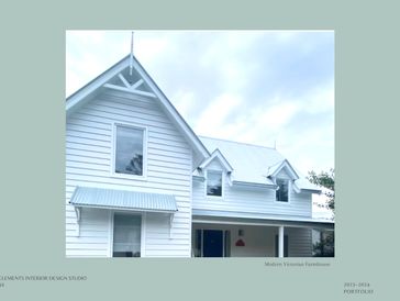 Modern Victorian farmhouse exterior with white weatherboards and gabled roof.”