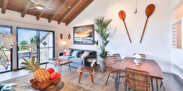 Maui Dream Place condo living room and dinning room view featuring Eames Lounge Chair Wood.