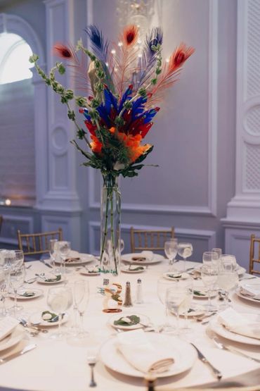 Trinidad Wedding theme Center piece at the Rockleigh 
Flowers feathers Venue :The Rockleigh, NJ