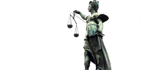 Statue of Lady Justice holding balanced scales.