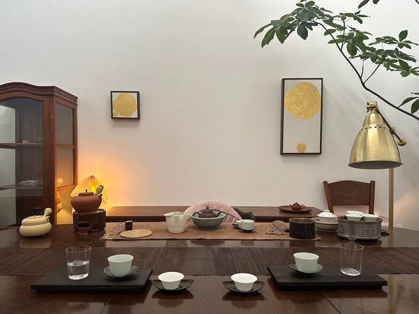 Minimalist tea setup with traditional pots and cups.