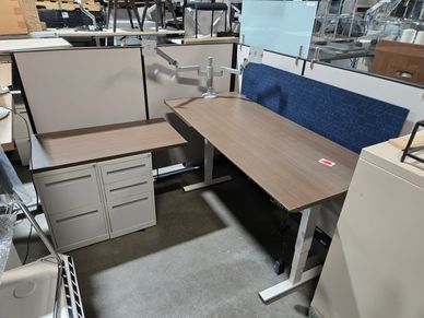 "Herman Miller 30x66 sit-to-stand desk with 24x42 return and file cabinets. Optional cubicle walls."