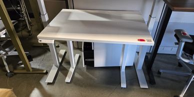 "Budget sit-to-stand desks, 42-inch and 48-inch wide options, $200." 