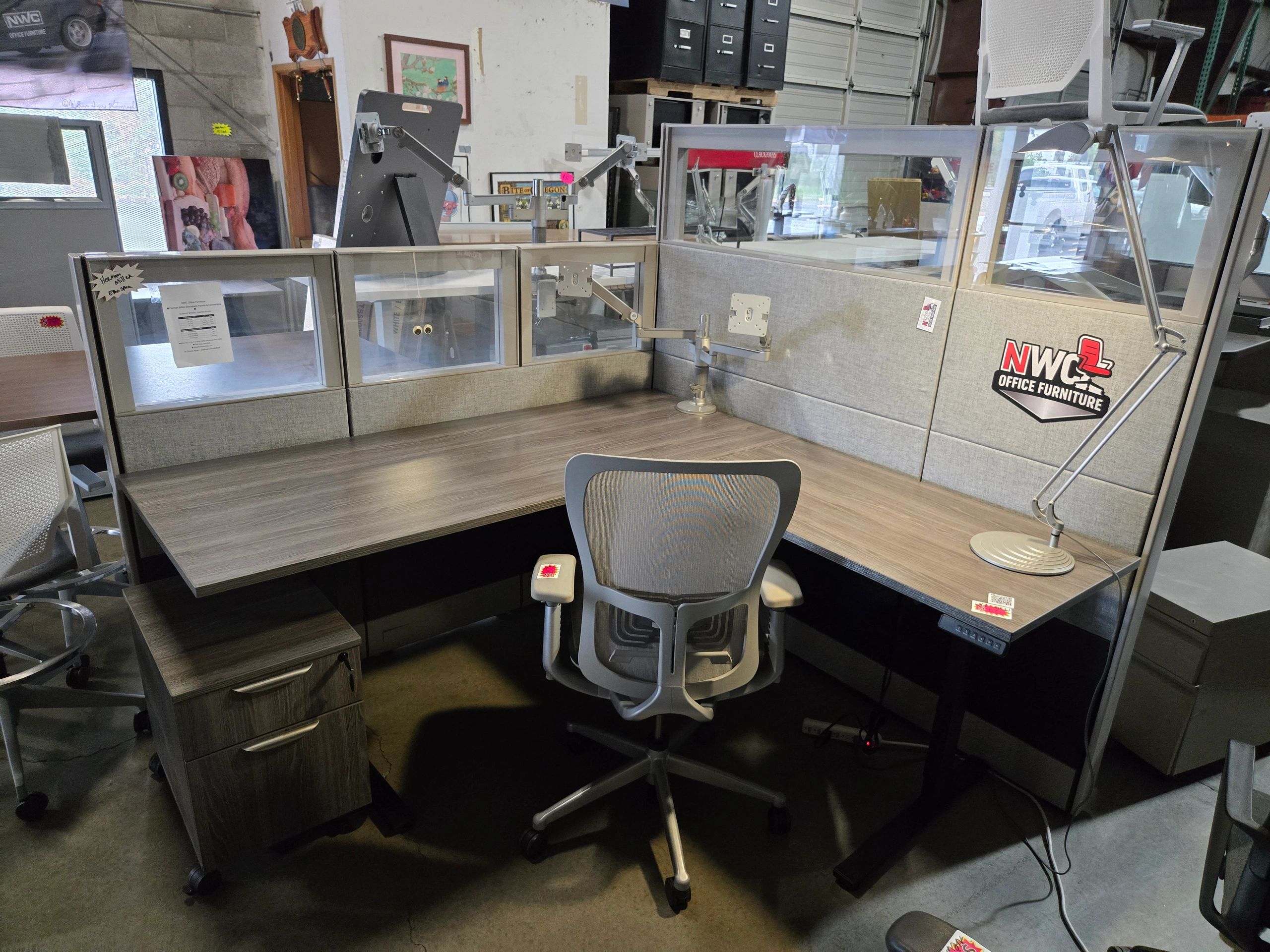 Refurbished Herman Miller Ethospace cubicle with new fabric, sit-to-stand desk, and custom logo 