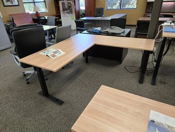 Aspen L shaped sit to stand desk electric workstation in modern office setting in Portland 