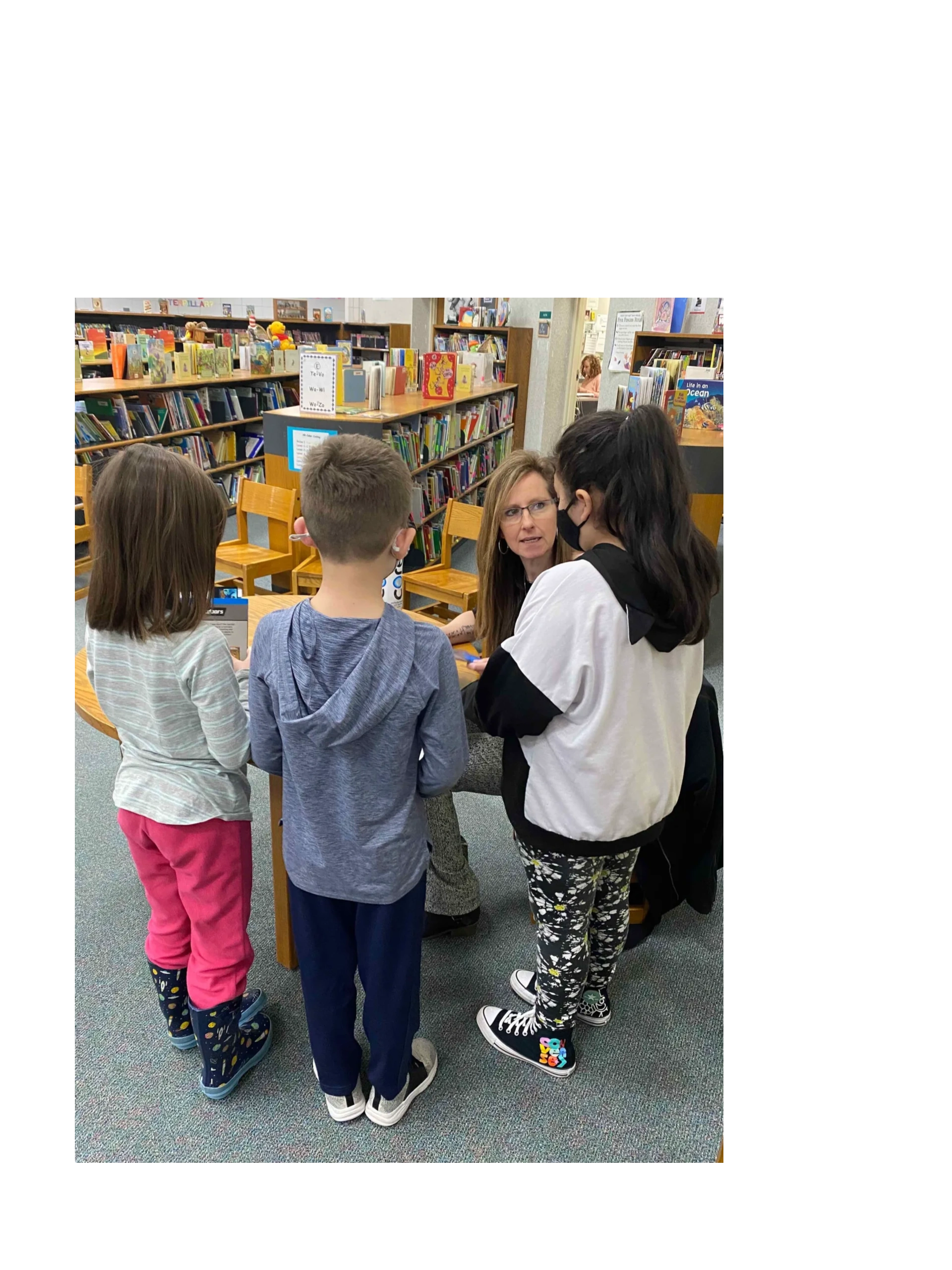 Lisa visiting with students at an elementary school.