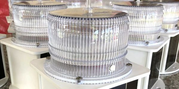 Solar-powered warning lights with clear protective covers.