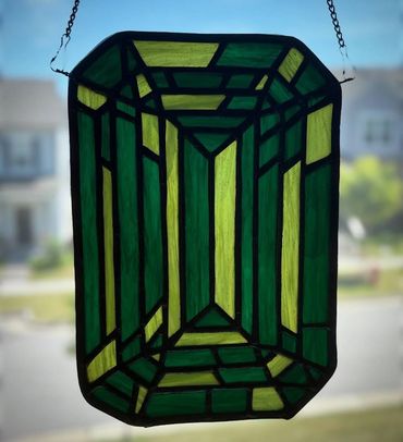 Light and dark green emerald gemstone inspired stained glass