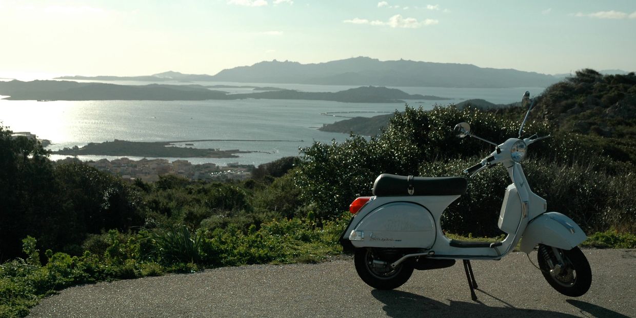 Our beloved Vespa in the hills of La Maddalena, Sardinia