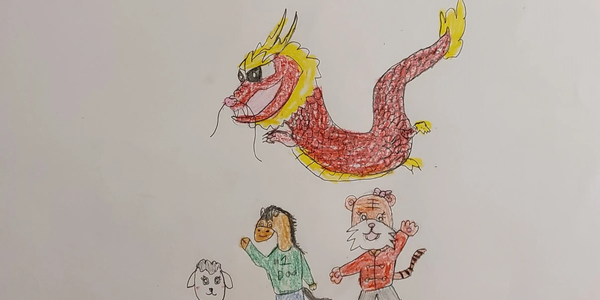 Colorful dragon and three animal characters drawn on paper.