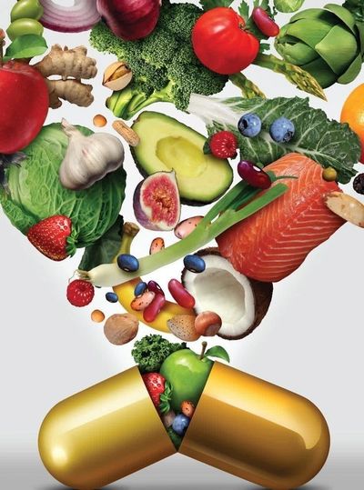 Golden capsule spilling fresh fruits, vegetables, nuts, and fish symbolizing natural health supplements.
