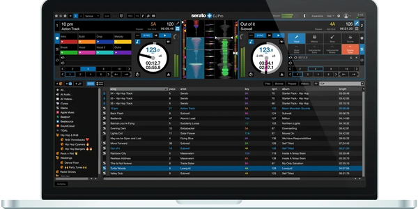 Laptop screen showing Serato DJ Pro software with two active decks and track library.