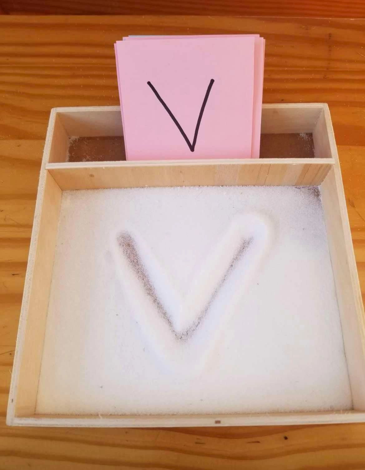 tracing letters, child development, sensory play