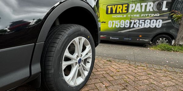 A tyre petrol banner on a van