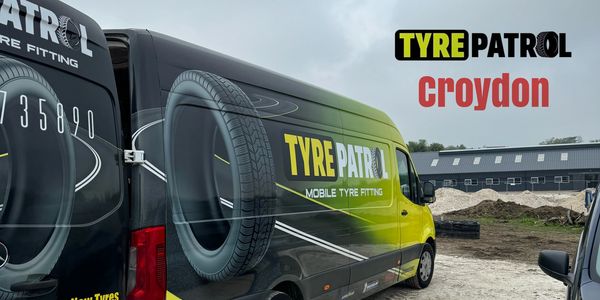 A black and yellow van parked