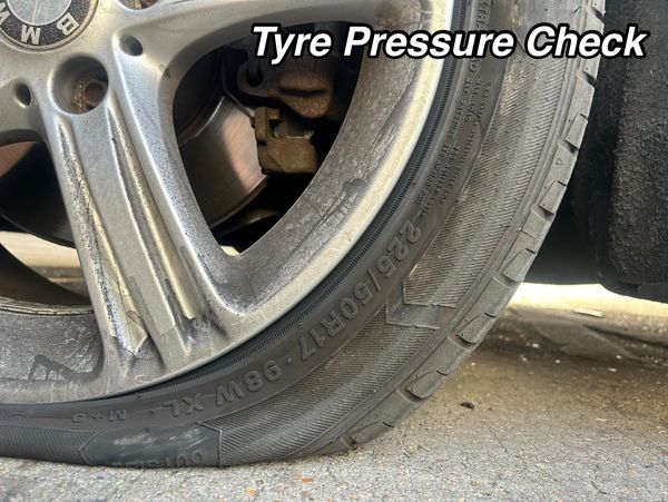 A closeup look at a deflated tyre of a car