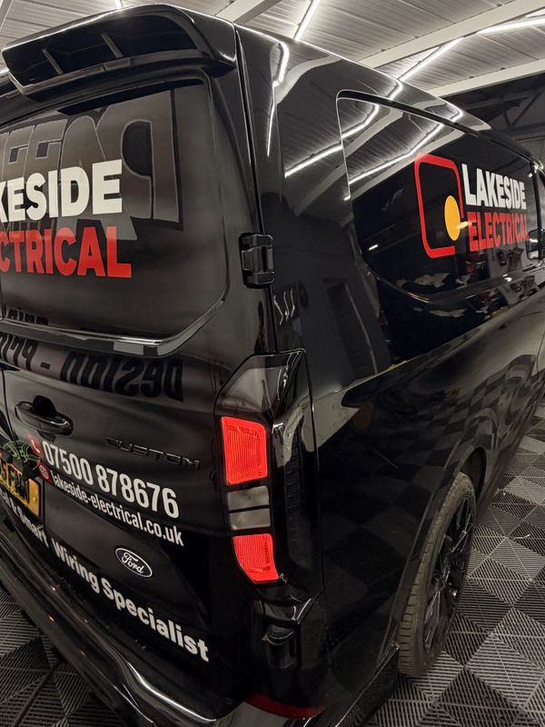 Black Lakeside Electrical van with contact details and branding.