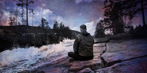 Author Jacques Bucheron meditating by the Isère river