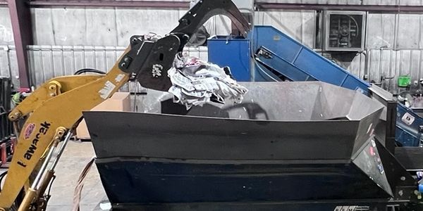 inside the recycling center, workers
