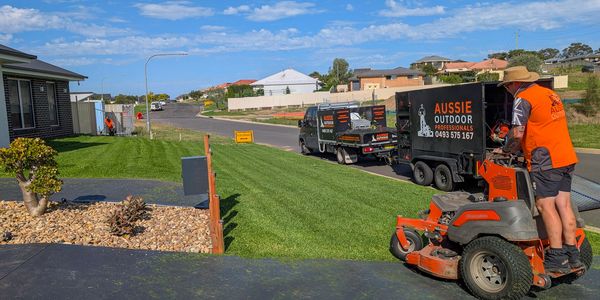 man on high quality lawn mower looking after lawn in Nowra
