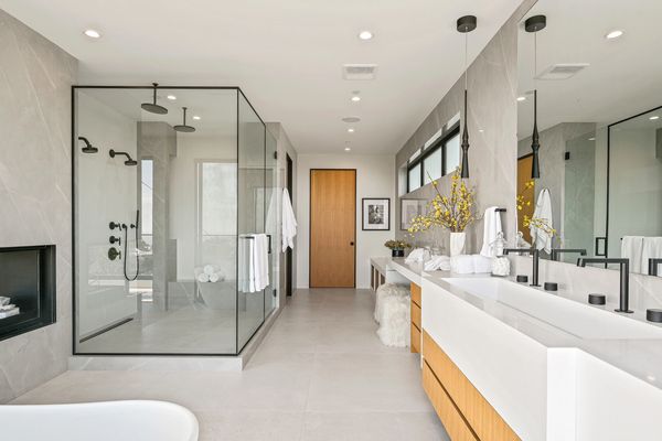Heavy glass primary shower with modern Matte Black framing 