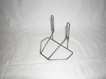 Metal wire stand or holder against white background.