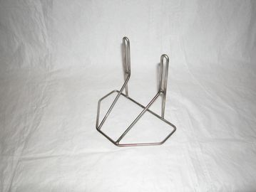 Metal wire stand or holder against white background.