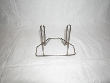Metal book holder on white background.