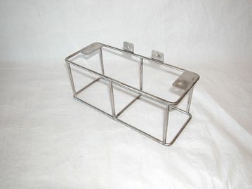 Metal wire rack with mounting brackets.