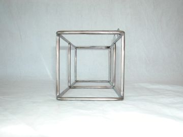 Metal wireframe cube structure.