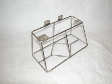 Metal wire frame structure on a white surface.