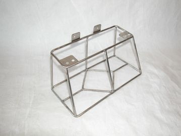 Metal wire frame structure on a white surface.