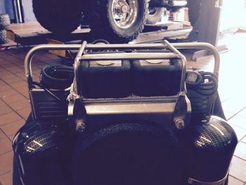 Back view of a blue miniature jeep model.