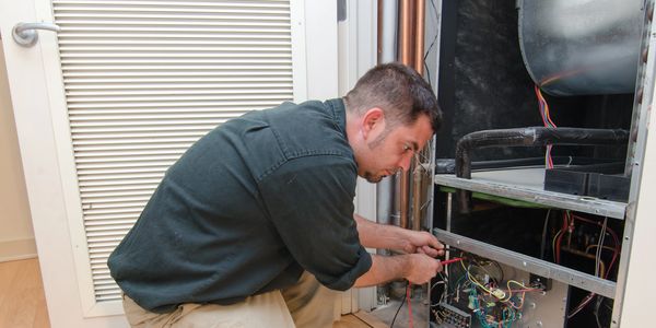 Heating and air conditioning technician in a service call for a repair