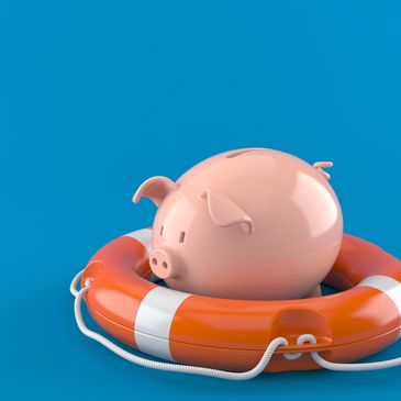 Photo of a piggy bank in a life saver on a blue background